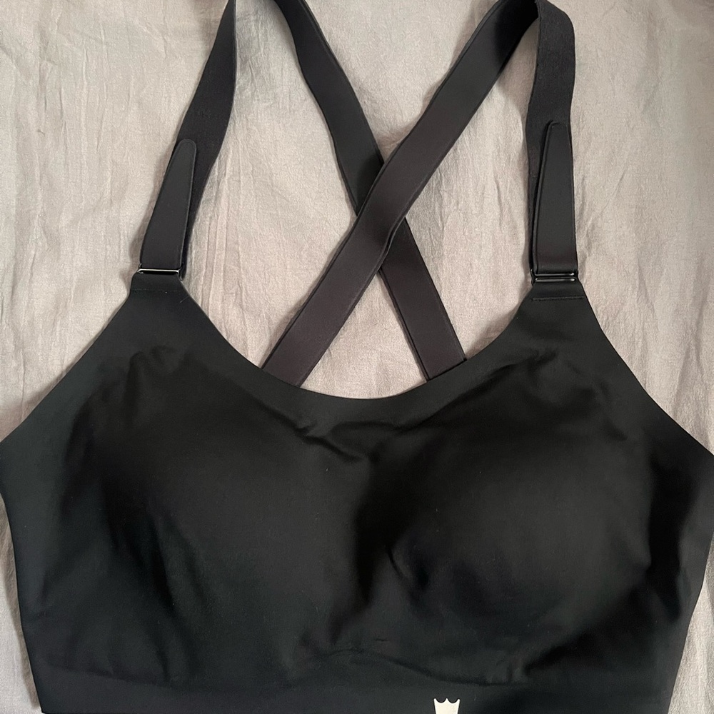 SHEFIT Black Sports Bra with Adjustable Support. Never worn.